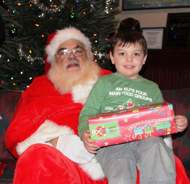 Children's Christmas Party at 8-100. 12-9-2012. Santa pays a visit . Photo by Vincent P. Tuzzolino